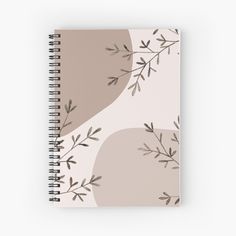 a spiral notebook with an abstract design on the front and back cover, featuring branches