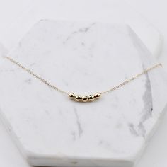 Friendship necklace. Friendship gift. Delicate mirror beads necklace. The necklace will be shipped in a beautiful gift box. ★ 14K yellow gold mirror ball bead is 4mm. ★ Necklace is 14K yellow gold 1.2mm flat cable chain. Please read our policies before you place your order. https://www.etsy.com/shop/SashJewelry/policy?ref=shopinfo_policies_leftnav To see other Mother daughter necklace set click here: https://www.etsy.com/shop/SashJewelry?section_id=12441134&ref=shopsection_leftnav_1 To see o Rose Gold Charm Necklace For Mother's Day, Mother's Day Rose Gold Charm Necklace With Locket, Mother's Day Rose Gold Tarnish-resistant Charm Necklace, Mother's Day 14k Gold-filled Charm Necklaces With Delicate Chain, Hypoallergenic 14k Rose Gold-filled Necklaces, Mother Daughter Necklaces Set, Other Mother, Simple Pearl Necklace, Necklace Friendship