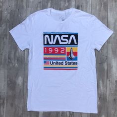 Nasa United States Shirt Shipping from the US. Easy 30 day return policy, 100% cotton, Double-needle neck, sleeves and hem; Roomy Unisex Fit. Fitted Graphic Tee Shirt With Front Print, Sporty Shirt With Text Print For Spring, Spring Sporty Shirt With Text Print, Sporty Spring Shirt With Text Print, Casual Streetwear Shirt With Front Print, Casual Cotton Shirt With Letter Print, Casual Fitted Shirt With Screen Print, Fitted Casual Shirt With Screen Print, Casual Short Sleeve Shirt With Front Print