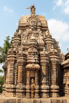 an old stone structure with carvings on it