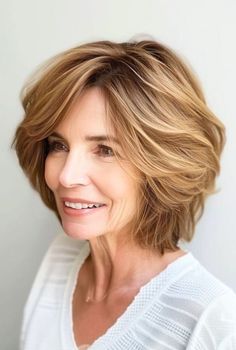 Pixie haircuts for women over 60 are the ultimate low-maintenance, high-impact hairstyle that will have you looking and feeling fabulous. Wash And Wear Haircuts, Feathered Layers, Long Hairstyles For Women, Hairstyles For Women Over 60, Hairstyles For Women Over 50, Medium Long Hair, Shag Hairstyles, Hair Advice, Haircuts For Medium Hair