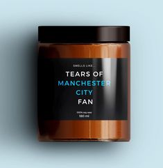 a jar of teas of manchester city fan on a blue background with the words, tears of manchester