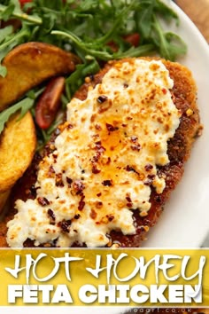 a white plate topped with meat and veggies next to potato wedges on top of a wooden table