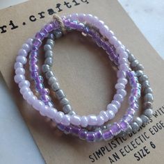 Perfect for the purple lover in your life, this stretch seed bead set delivers all the lavender vibes. Lilacs and iridescence create the perfect combo for all your pastel dreams. (Bracelet sold as a set)Size shown: 7 inches Strung on pre-stretched bracelet material. SIZINGThe sizing chart is the standard for stretch bracelets. Since material is pre-stretched there is some leeway or give as far as how the bracelet fits on your wrist. TIP FOR MEASURING: Best rule of thumb when measuring your wrist Lavender Beaded Bracelets With Round Beads As Gift, Adjustable Lavender Bracelets With Spacer Beads, Lavender Bracelets With Tiny Beads For Gift, Bohemian Purple Stretch Bracelet With Faceted Beads, Purple Stretch Bracelet With Tiny Beads As Gift, Adjustable Lavender Beaded Bracelets With Tiny Beads, Adjustable Lavender Bracelet With Tiny Beads, Lavender Beaded Bracelet With Tiny Beads For Gifts, Adjustable Purple Faceted Beads Stretch Bracelet