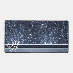 the monogrammed blue and silver glitter mouse pad is shown with an elegant monogramming