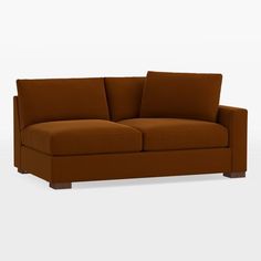 a brown couch sitting on top of a white floor