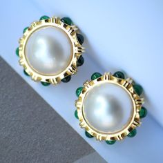 --- SPECIFICS --- 💚Materials: 100% Natural High Quality Seawater Mabe Pearl. Green Zircon. 24k gold plated s925 Sterling silver 💚-The Mabe Pearl is 100% natural UNTREATED , UNHEATED, UNDYED Mabe Pearl- 💚Metal: Real 24k Gold plated s925 Sterling Silver 💚Pearl Diameter: 18.5mm*18.5mm 💚Closure: the closure is made of 925 Sterling Silver.  💚Handmade Artwork, original design and copyright protected💚 These stunning gold plated silver earrings feature a beautiful pair of hemisphere Mabe Pearl st Green Round Pearl Earrings For Formal Occasions, Green Pearl Earrings For Formal Occasions, Green Round Classic Pearl Earrings, Gold Cabochon Earrings For Wedding, Green Stone Earrings, Earrings With Pearls, Mabe Pearl, Gold Pearl Earrings, Cameo Pendant