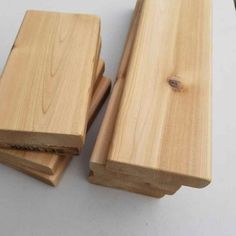 two pieces of wood sitting next to each other