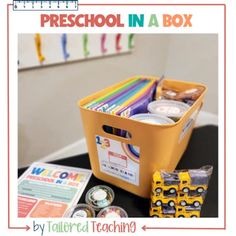 there is a yellow box with school supplies in it and the words preschool in a box above it