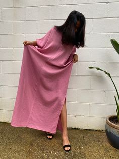 Embrace the gentle waves and sunny shores with our double gauze cotton kaftan in bubblegum pink. This versatile floor-length kaftan falls gracefully just above the ankles (depending on your height), making it the perfect beach dress or cover up. Crafted from light and airy double gauze cotton, it's your essential for a night on the town, a day by the sea, or just running errands. Breezy Relaxed Fit Maxi Dress For Daywear, Breezy Maxi Dress For Loungewear, Breezy Maxi Length Dress For Loungewear, Flowy Breezy Maxi Dress For Loungewear, Breezy Flowy Maxi Dress For Loungewear, Breezy Pink V-neck Maxi Dress, Oversized Summer Maxi Dress For Daywear, Oversized Maxi Dress For Summer Daywear, Pink Breezy Beach Cover-up Dress