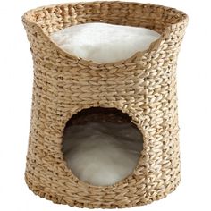 a wicker basket with a white pillow in it's center and an opening at the top