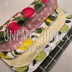 three unpatter towels are stacked on top of each other with the words, unpaper towels single ply