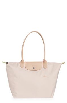 Embossed leather trims this roomy must-have tote featuring a fold-flat design for compact storage. Shoulder straps Structured silhouette with flat base for stability Unlined Polyamide with leather trim Imported Girly Bags, Recycled Canvas, Stockholm Fashion, Mode Ootd, Pretty Bags