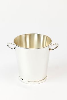 a silver pot with handles on a white background