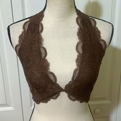 This Sultry Lace Bra Is Designed In A Halter Silhouette With Sweet Scallop Trim. Halter Neck Partially Lined 90% Nylon, 10% Spandex Hand Wash, Line Dry Imported Delicate Lace Camisole Fitted Bra, Fitted Lace Camisole Bra, Lace Camisole Bra, Fitted Delicate Lace Camisole Bra, Delicate Lace Fitted Camisole Bra, Delicate Lace Camisole Bra, Elegant Fitted Bra With Lace Top, Fitted Lace Bra In Coquette Style, Fitted Lace Bra With Sheer Details