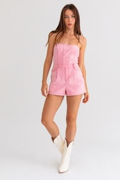 An exclusive, limited edition denim tube style romper in a light pink shade. Model sizing: True to size but if you are in-between sizes, we recommend sizing up. Model is wearing a size small. Height: 5'8" Bust: 32A Waist: 24" Hips: 34" Fabric content: 70% Cotton, 27% Polyester, 3% Spandex Trendy Strapless Jumpsuit With Pockets, Trendy Strapless Jumpsuit With Pockets For Summer, Trendy High Waist Strapless Jumpsuit With Pockets, Trendy Strapless High Waist Jumpsuit With Pockets, Casual Strapless Denim Jumpsuit With Pockets, Casual Cotton Strapless Jumpsuit With Pockets, Trendy Strapless Jumpsuits And Rompers With Pockets, Casual Strapless Jumpsuits And Rompers With Pockets, Strapless Denim Jumpsuit With Pockets For Summer