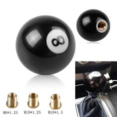 black and white ball with eyeballs on the center console in a car or truck