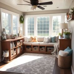 a living room filled with furniture and lots of windows