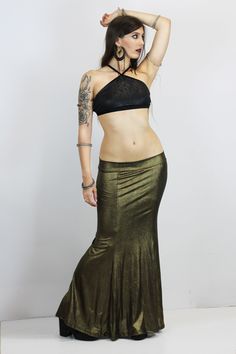 GOLD VINTAGE MERMAID SKIRT This gorgerous metallic mermaid skirt is available in old gold and dark silver colors, perfect to level up any look with this metallic efect. The beautiful mermaid shape makes every body type look gorgerous and stylized. Perfect for several looks, night outfits, stage and performances, or a more casual extravagant look, your choice! Super elastic and incredibly confortable, it adapts perfectly to all your movements. Long strech mermaid skirt. They can be machine washed Gold Stretch Skirt For Party, Vintage Stretch Party Skirt, Vintage Stretch Skirt For Party, Fitted Gold Flared Skirt, Gold Fitted Flared Skirt, Party Maxi Skirt With Stretch In Fishtail Style, Party Fishtail Maxi Skirt With Stretch, Fishtail Stretch Maxi Skirt For Party, Stretch Mermaid Hem Skirt For Night Out