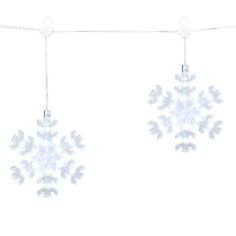 two snowflakes hanging from a clothes line