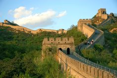 the great wall of china with people walking on it