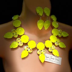 Neon brightness- this yellow crystal necklace finished in premium stones is fun and vibrant, make a statement with this eye catching sparkly piece! Super sparkly and set in a silver plate cup chain, this truly is a gorgeous set, and is available with or without matching earrings. Each of the faceted crystals are handset and encased in a stunning electro-finished setting for ultimate sparkle.   *Silver plated *Premium cut colourful crystal for brilliant sparkle *Adjustable for comfort, up to 22" Yellow Crystal Necklace For Party, Yellow Rhinestone Jewelry For Party, Yellow Rhinestone Party Jewelry, Necklace Set Silver, Dramatic Necklace, Faceted Crystal, Austrian Crystal, Neon Yellow, Matching Earrings