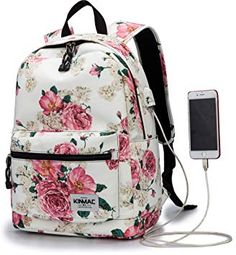 a white backpack with pink flowers on it and an mp3 player plugged into the charger