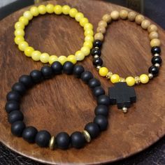 Black And Yellow Beaded Bracelet Set Adjustable Yellow Bracelet With Wooden Beads, Yellow Bracelet With Round Wooden Beads, Yellow Wooden Bead Bracelets, Yellow Wooden Beads Bracelet, Yellow Casual Jewelry With 8mm Beads, Casual Yellow Jewelry With 8mm Beads, Adjustable Yellow Wooden Beaded Bracelets, Spiritual Yellow Beaded Bracelets With 8mm Beads, Casual Yellow Beaded Bracelets With 8mm Beads