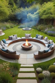 a circular fire pit surrounded by grass and rocks in the middle of a garden with seating around it