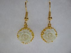 These dainty rose earrings are mounted on a brass filigree and hang on fish hook style earwires. You choose the color rose you want and the color filigree and wires. Not recommended for children under 3 due to small parts. Gold Earrings With Rose Design For Gift, Gold Earrings With Rose Design As Gift, Formal White Jewelry With Rose Design, Formal White Rose Design Jewelry, White Flower-shaped Earrings With Rose Design, White Flower Earrings With Rose Design, Gold Rose Design Earrings For Wedding, Dangle Earrings With Rose Design For Wedding, White Bridal Earrings As A Gift