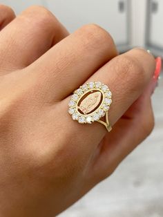 14K CZ Halo Virgin Mary Ring -Solid 14K REAL Gold !! -Very nice Virgin Mary ring -Two toned finish, yellow gold with rose gold Virgin Mary in the center -A cubic zirconia halo -Available in a size 7 US -Can be worn on a daily basis (Message us if you have any other questions ) Rose Gold 14k Gold Halo Ring, 14k Rose Gold Cluster Ring With Halo, 14k Rose Gold Halo Cluster Ring, Rose Gold 14k Halo Ring, Gold Cubic Zirconia Diamond Ring With Halo, Gold Cubic Zirconia Cluster Ring With Halo Design, Gold Cubic Zirconia Ring With Halo Detail, Gold Cubic Zirconia Rings With Halo Design, Virgin Mary Ring