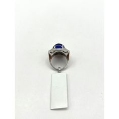 This is part of Chairish’s Fine Jewelry assortment.  Gorgeous big size tanzanite rectangular cabochon with good quality white diamond rounds.  Handmade in 18k white gold.  This ring was bought in a large lot so accurate weights are unknown but close approximation can be given in message.  Ring size 7.25. Elegant Sapphire Signet Ring, Elegant Formal Cabochon Ring, Formal Tanzanite Ring With Bezel Setting, Silver Cabochons For Formal Fine Jewelry, Elegant Sapphire Signet Ring With Polished Finish, Fine Jewelry Silver Cabochons For Formal Occasions, Formal Sapphire Cabochon Rings, Silver Cabochons For Formal Occasions, Formal Sapphire Rings With Cabochon