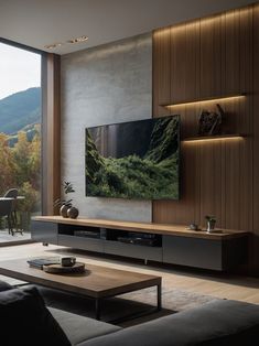 a large flat screen tv mounted to the side of a wall in a living room