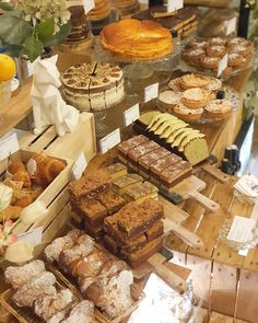 an assortment of pastries on display in a bakery