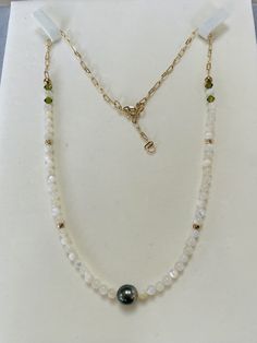 Welcome to Mandyhboutique! Genuine high luster near round Tahitian pearl in the middle size about 7.5-8mm. The necklace consists of mother of pearl beads, swarovski crystal and 14k gold plated extended chain.  *tahitian pearls are unique and rarely perfect. Sometimes they will have slight imperfections, small blemishes or irregular shapes.* **handmade jewelry** **Warranty** We do understand that handmade jewelry can be delicate, that's why we are offering a 30-day warranty for your purchase. If your item has a manufacturing defect or broken during this time frame, please contact us and we will offer free repair for you. Please note we are not responsible for normal wear and tear or failure to adhere to the care instruction on the jewelry. Some of the items can be customized if you have a d Tahitian Pearl Necklace For Wedding, Tahitian Pearl Drop Necklace For Wedding, Elegant Rondelle Pearl Necklace With Faceted Beads, Pearl White Necklaces With Faceted Beads, Elegant Faceted Rondelle Pearl Necklace, Elegant Pearl Necklace With Faceted Rondelle Beads, Pearl White Necklace With Faceted Beads, Elegant Pearl White Necklace With Faceted Beads, Elegant Pearl Necklace With Gemstone Beads For Anniversary