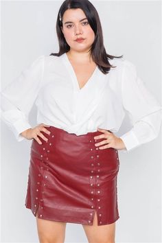 PLUS LOVE 🖤 CUSTOMER FAVORITE Cherry red mini skirt Front features stud grommets & slits Premium, soft vegan faux leather Hidden side zip 50% PU, 50% Polyester Stretchy, true to size Model wears 1X & is 5’6", Waist 39”, Hips 50” Measurements approximately: 1X: Waist 36" Hips 44" Length 18.5" 2X: Waist 38" Hips 46" Length 19" 3X: Waist 40" Hips 48" Length 19.5" Retro Club, Mini Leather Skirt, Red Mini Skirt, White Blouses, Boutique Couture, Faux Leather Mini Skirt, Leather Mini Skirt, Club Wear, Online Fashion Boutique