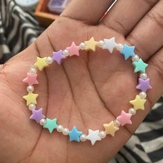 Stretchy pastel stars and pearls beaded bracelet.  One size fits most, made from stretchy bead jewelry string. Handle with care, keep away from children under 9 years old.  Keep away from toddlers, babies and infants. Avoid pulling, stretching and expanding bracelet too far out or it'll break of course Pastel Stars, Pearl Beaded Bracelet, Pearl Jewellery, Bracelet Ideas, Bead Jewelry, Pastel Rainbow, Infants, Pearl Beads, Pearl Jewelry