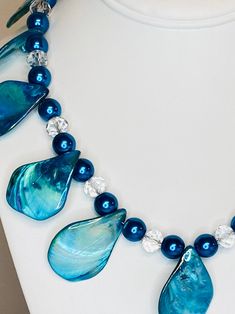 Blue Beaded Shell-shaped Necklace, Blue Ocean-inspired Shell Necklace, Ocean-inspired Blue Shell Necklace, Elegant Handmade Blue Shell Necklace, Ocean-inspired Blue Shell Beaded Necklaces, Handmade Ocean-inspired Blue Shell Necklace, Blue Shell-shaped Necklaces, Blue Shell-shaped Adjustable Necklace, Blue Ocean-inspired Shell-shaped Necklace