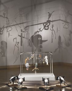 an artistic display in a museum filled with sculptures