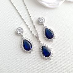 Sapphire Blue Stone Earrings, Bracelet, Necklace Set Made of Cubic Zirconia for Weddings If you are looking for matching earrings, necklace bracelet set in blue color, this sapphire blue store jewelry set with matching earrings, necklace, and adjustable bracelet is a beautiful set. The sapphire blue stone jewelry set is great for the bride, bridesmaids, and every woman looking for sapphire blue color jewelry. They are made of high-quality cubic zirconia and are available in silver, gold, and ros Sapphire Blue Weddings, Blue Earrings Wedding, Blue Bridal Earrings, Blue Stone Earrings, Blue Jewelry Set, Blue Stones Jewelry, Blue Wedding Jewelry, Gold Earrings Wedding, Blue Bridal