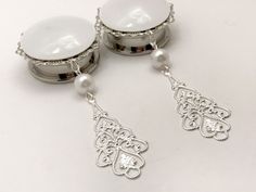 "Pair of 1\" 25mm surgical steel dangle plugs with white faux pearl bead and silver filigree dangle. Plug metal lace base is 35mm White center is 30mm Dangles slightly over 2\" long Plug wear area 6mm Made to order. Please allow 2-4 days creation time. Shipped in a gift box for safe travel and storage. Please contact me with any questions Love and light! Additional Information: Due to the nature of the product, returns are generally not accepted. Please see shop policies for full information. Al White Metal Pearl Earrings, Pierced, White Metal Pearl Earrings Pierced, White Metal Pearl Earrings, Elegant Dangle Plug Earrings With Internal Threads, White Metal Dangle Plug Earrings, White Filigree Dangle Jewelry, Nickel-free Metal Plug Earrings For Wedding, White Internally Threaded Earrings For Wedding, White Teardrop Plug Earrings As Gift