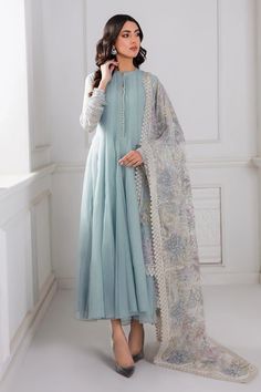 Introducing our stunning Light Blue Chiffon Silk Suit Anarkali Dress, complete with an embroidered net dupatta and a grip silk trouser. Create a head-turning look with this elegant 3-piece set, including the top, trouser, and dupatta, along with accompanying accessories. Elevate your style with the luxurious embroidered chiffon fabric. Top Fabric: Chiffon Dupatta Fabric: Embroidered Net Trouser Fabric: Grip silk Top Length: 50"-52" Sleeves Length: 21"-23" Bottom Length: 36"-37" Condition: New Oc Pastel Blue Anarkali, Pakistani Dupatta Designs, Party Wear Dress Ideas, Pakistani Frock Design, Blue Pakistani Dress, Dyed Pants, Pakistani Party Wear, Party Frocks, Pakistani Fancy Dresses