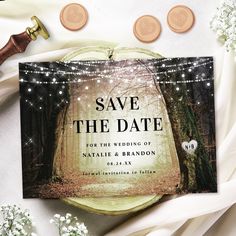 wedding save the date cards on top of a table