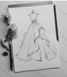 a drawing of a dress and flowers on a table