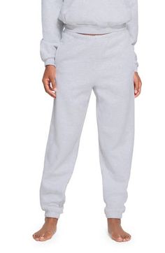 Cozy up in these cotton-blend fleece sweatpants designed with an easy elastic waist for laid-back vibes that totally fit the theme of Kim Kardashian's SKIMS. 31" inseam; 11" leg opening; 11 1/2" front rise; 16" back rise (size Medium) Elastic waist 70% cotton, 30% polyester Machine wash, tumble dry Imported