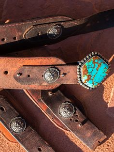 3 inch wide reclaimed ranch leather concho belts! Shown here with our Lakota Concho, fine, handmade and Navajo stamped. Some of this leather is over 100 years old and takes weeks to clean, seal and restore. It's is a dirty job, but very rewarding and giving new life to something that would otherwise be thrown away. Available in canyon tan and dark vintage brown. Buckles sold on the "Buckles" page, not included. I do my best to keep these on hand, but may have to custom build. Please contact us i Concho Belts, Dark Vintage, Concho Belt, American Turquoise, Casual Outerwear, Saddle Leather, Green Tones, Cuff Earrings, Blue Tones