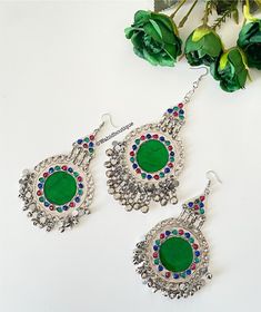 Afghan green vintage tikka and earrings set, Afghan jewellery, Afghan Fashion  Set includes: -1 pair of oversized earrings  -1 oversized tikka  Message for any enquiries Our Aim as a business is to connect Afghan women with their roots and to make anyone that purchases our jewellery feel powerful and beautiful as each and everyone of our items is handcrafted with care and love. Bohemian Green Danglers For Party, Festive Green Vintage Jewelry, Bohemian Green Earrings For Wedding, Green Bohemian Earrings For Wedding, Heavy Green Tikka For Party, Festive Green Bohemian Earrings, Festive Green Metal Danglers, Green Metal Danglers For Festive Occasions, Bohemian Green Chandbali Danglers