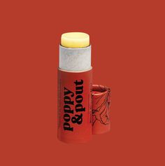 Image of a open lip balm with a dark red paperboard tube and text poppy & pout on a dark red background Peach Lip Balm, Coconut Lip Balm, Peach Lips, Cinnamon Essential Oil, Marshmallow Creme, Lip Balm Tubes, Orange Creamsicle, Flavored Oils, Natural Lip Balm