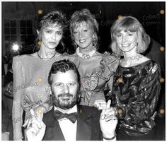 three women and one man posing for the camera