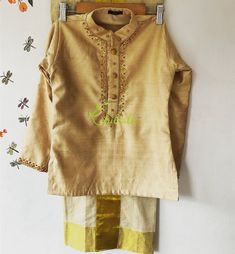 The Outfit consists of Kurtha and Mundu.The Kurtha made of Rawsilk fabric and is embellished with maggam work.The quality and embellishments makes this unique.The Mundu is made of premium quality Kerala Handloom Kasavu fabric.Velcro pasting at waist. So it’s easy to wear for kids.The Kurtha is lined with soft cotton fabric.Size: The picture shows 5-7 year baby boys dress.Any customisation of colours of Kurtha, please let me know. Festive Embellished Multicolor Embroidered Set, Diwali Embellished Multicolor Embroidery Sets, Traditional Semi-stitched Embellished Kurta, Embellished Straight Kurta For Festivals, Traditional Embellished Semi-stitched Kurta, Traditional Embellished Transitional Kurta, Embellished Raw Silk Traditional Wear For Eid, Festive Raw Silk Dress With Multicolor Embroidery, Embellished Raw Silk Saree Set